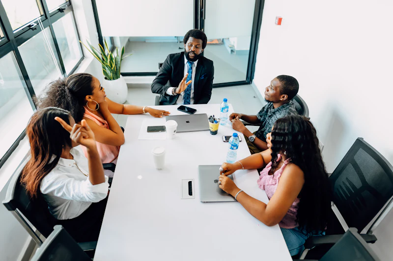 Meeting at a long table in a conference room